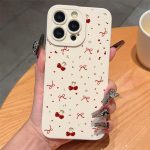A Vintage-Style White Polka Dot Bow And Cherry TPU Shock-Resistant Case That Offers Complete Protection, Specifically Made for Apple Iphone Models 6 Through 16 Pro Max.
